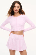 Pink micro-dot mini skirt with pleated flared waist and hem