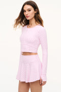 Long-sleeve cropped jacket in mauve-pink with allover bow print and zip front