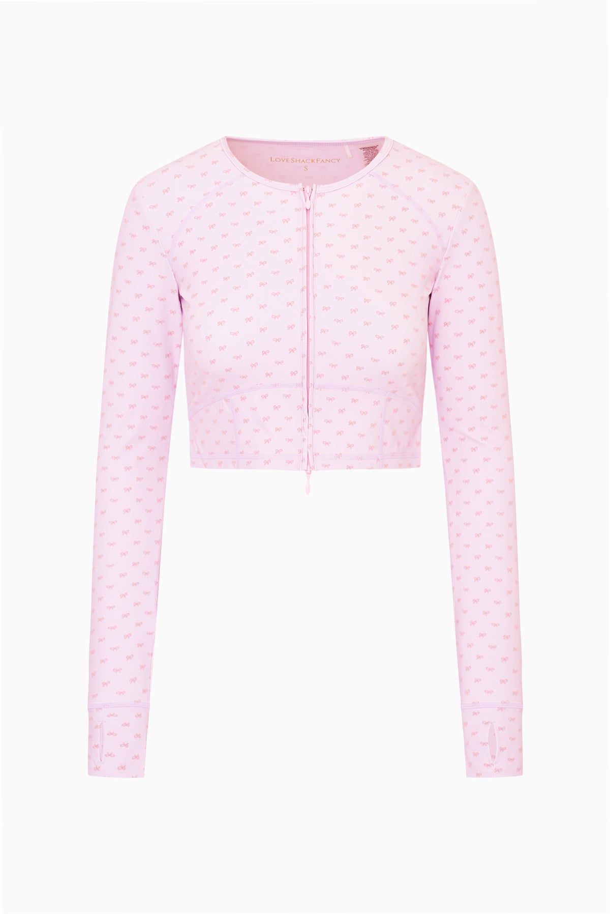 Front view of mauve-pink zip jacket with allover bow pattern, long sleeves