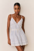 Floral cotton mini dress with V-neck lace trim, button front, and tiered skirt