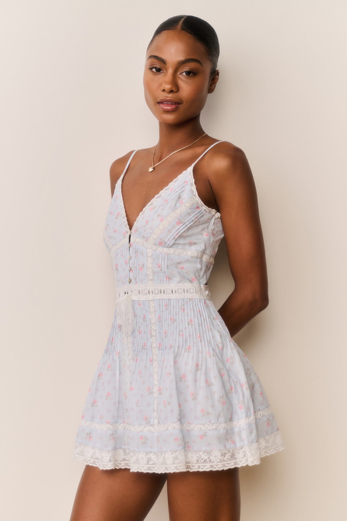 Floral cotton mini dress with lace trim, spaghetti straps and V-neck buttons
