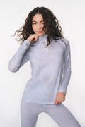 Women’s light blue half-zip pullover with subtle allover pattern and long sleeves