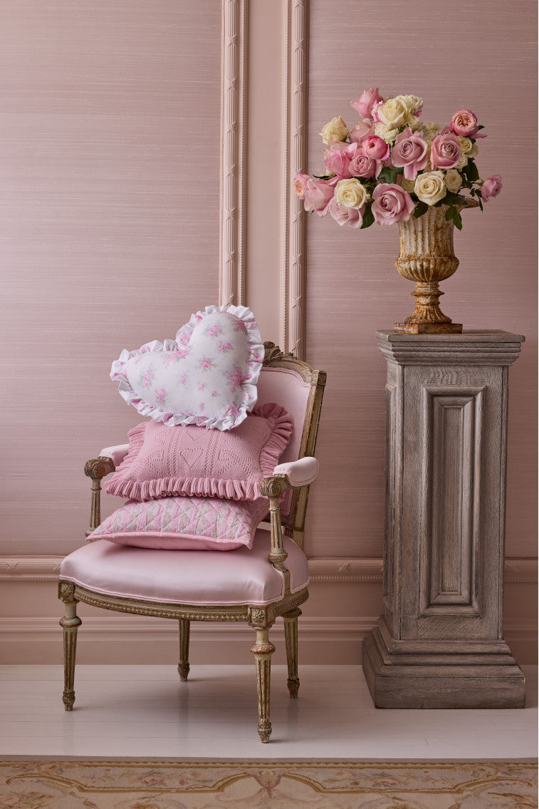 Ruffle heart pillow with pink floral print and gathered ruffle trim