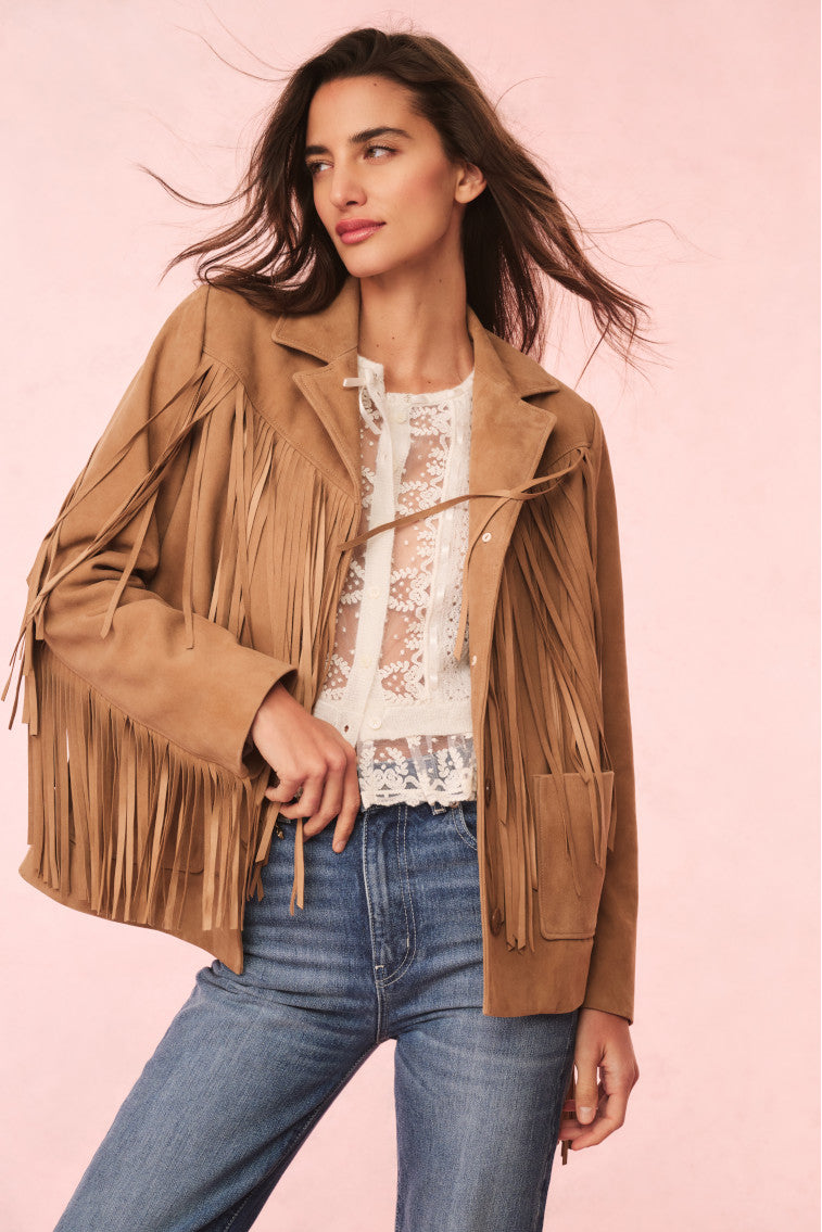 Camel suede fringe jacket with long tassels, worn with lace top and jeans