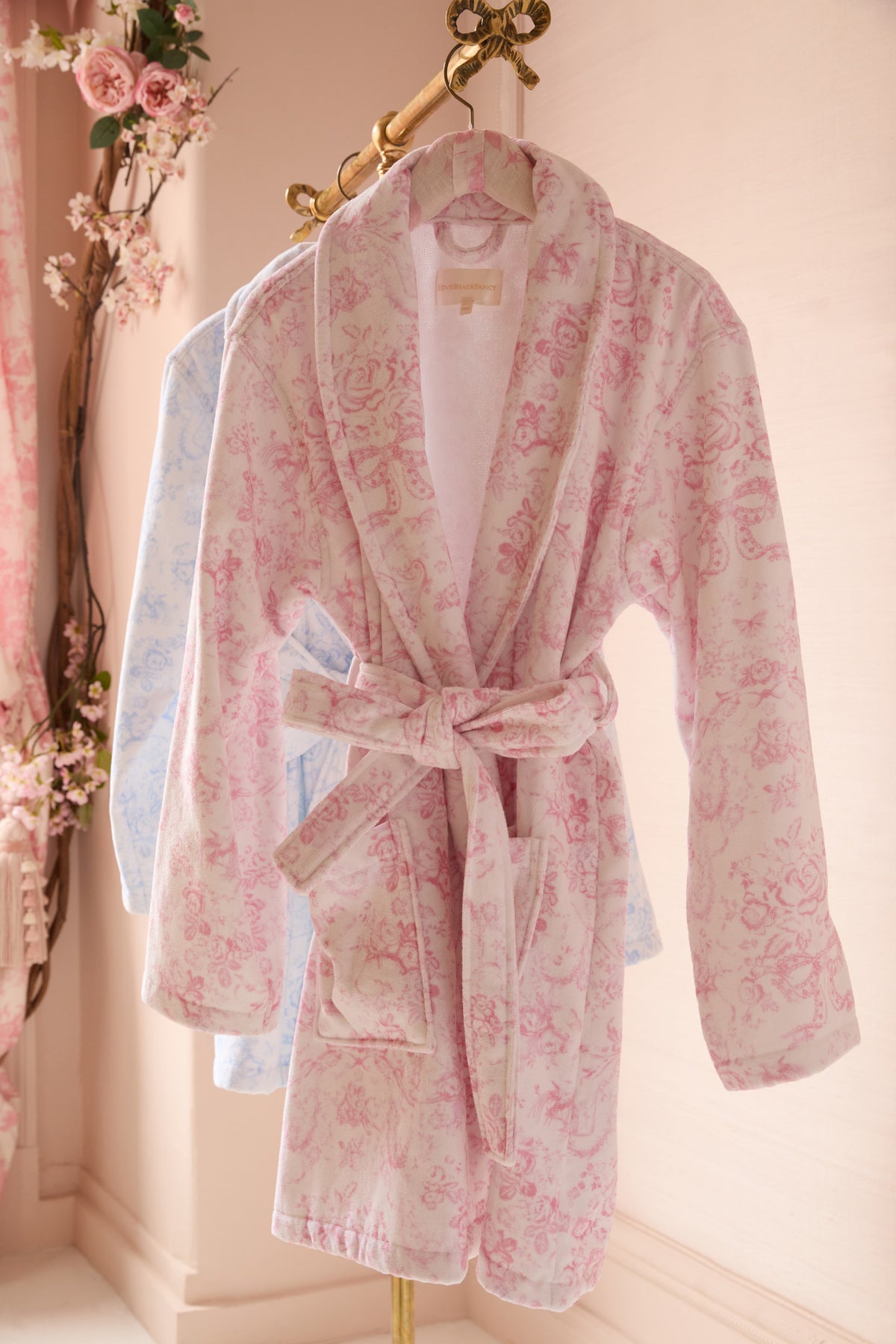 Light pink floral cotton bath robe on hanger, belt tie waist and hooded neckline