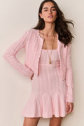Pink pointelle stretch cardigan with open front, long sleeves, vertical knit pattern