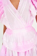 Pink tiered mini dress with V-neck and ruffled sleeves, cinched waist