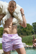 Lilac floral swim shorts with side tie and elastic waistband, allover print.