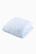 Floral duvet cover and sham set in light blue with allover pattern, neatly folded