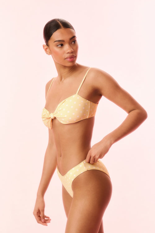 Marigold yellow polka-dot bikini set with adjustable thin straps and center bow