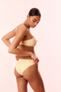 Marigold yellow polka-dot bikini set with twist-front bandeau top and high-cut briefs