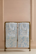 Cotton bath towel set, light blue floral bow pattern, neatly folded pair.
