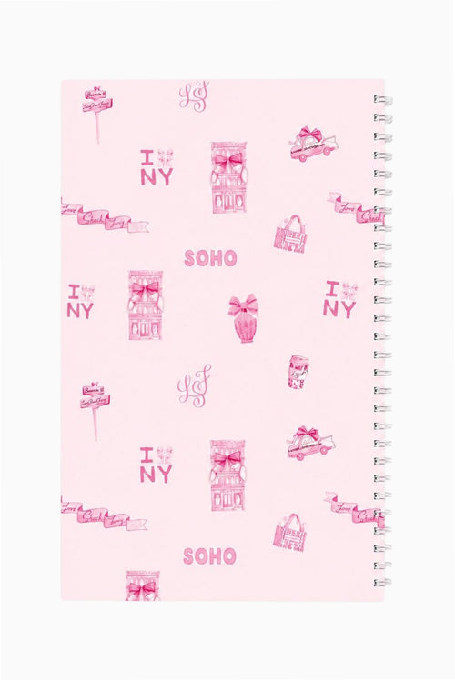 Spiral notebook with pink SOHO print cover and metal coil spiral binding on right