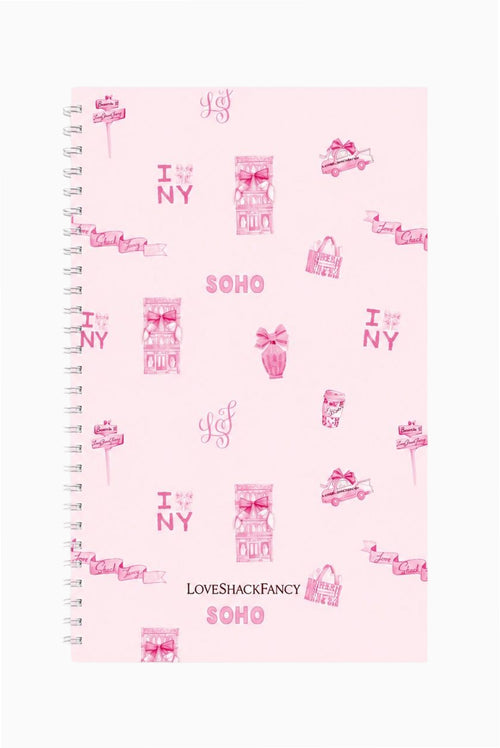 Spiral notebook with pink SOHO print cover and metal coil spiral binding on left