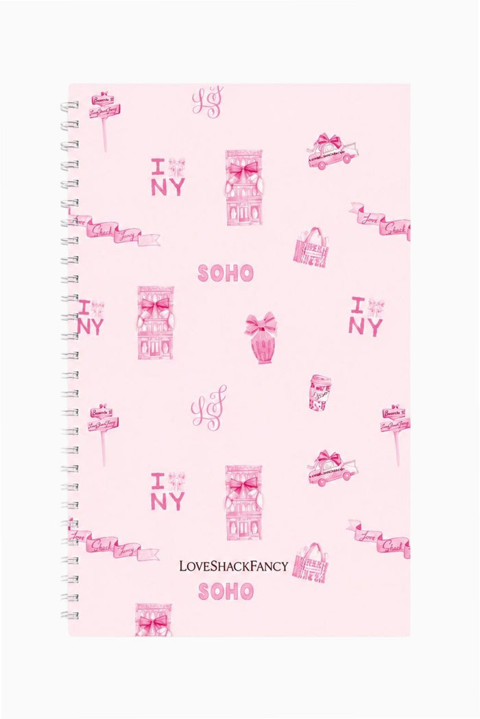 Spiral notebook with pink SOHO print cover and metal coil spiral binding on left