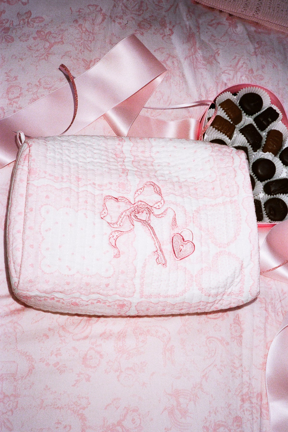 Pink lace Octavia bag with heart embroidery, zip top and short handle