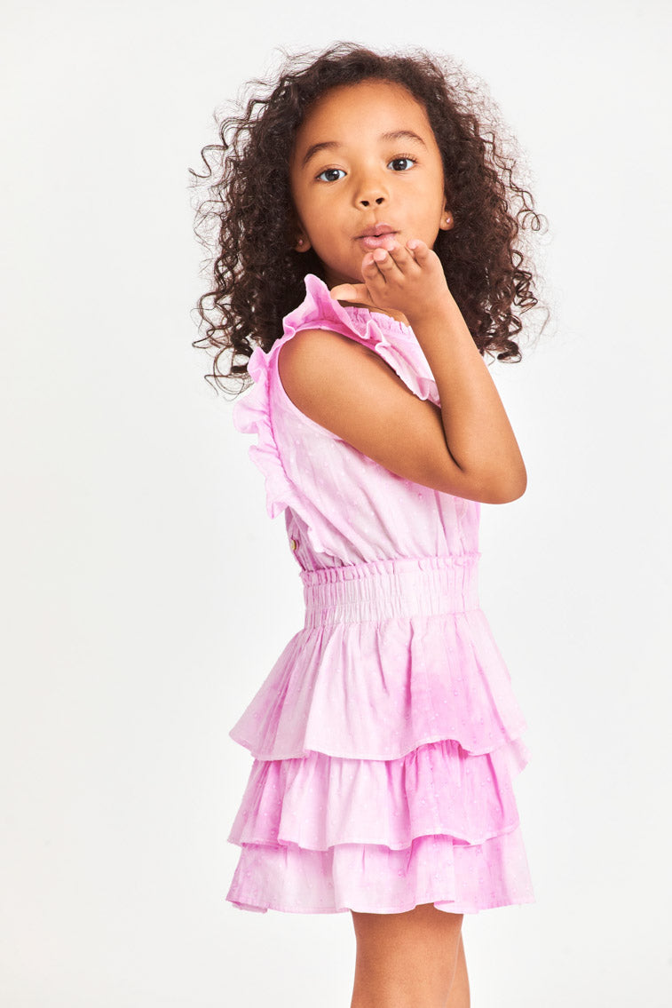 Girls pink tiered ruffle dress, front view with smocked waist and ruffled neckline