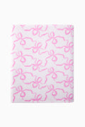 Cotton bath towel, pink floral bow pattern, flat folded view.