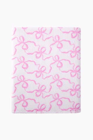 Cotton bath towel, pink floral bow pattern, flat folded view.