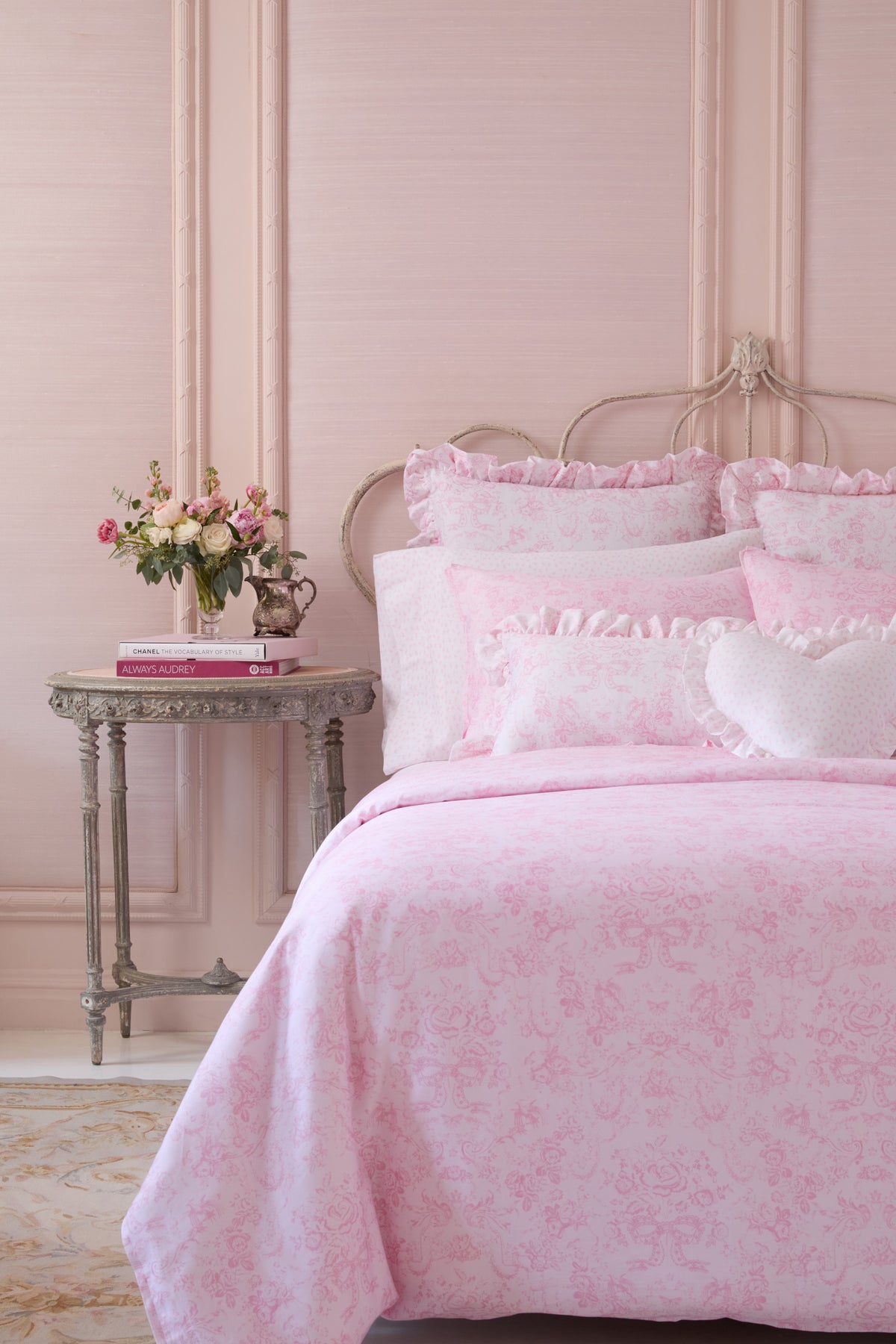 Pink floral duvet cover and sham set with ruffled pillows and heart accent