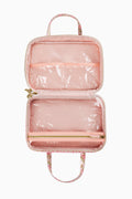 Peach glossy travel box with top handle, open two-compartment interior