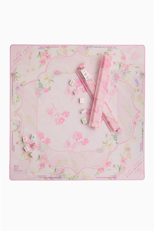 Mahjong mat with pastel floral pattern and scattered tiles