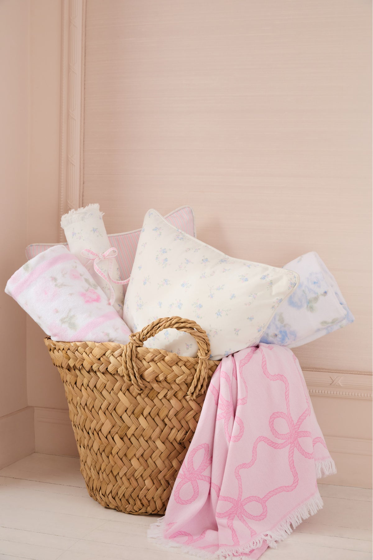 Hali beach towel set featuring folded blue floral towel and folded pink floral towel
