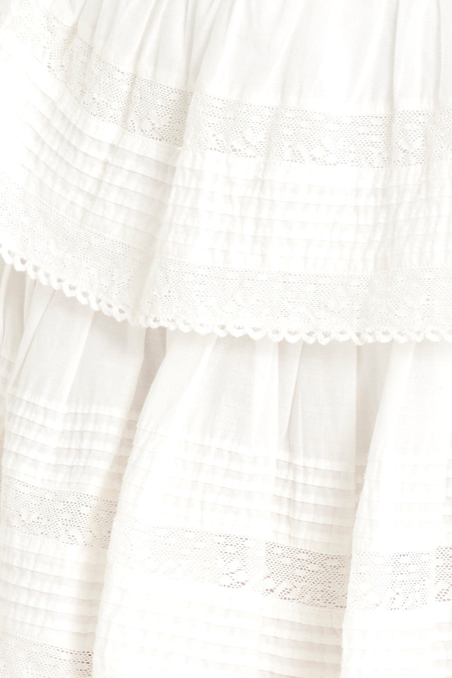 White ruffle mini heritage skirt fabric with subtle lace-edged tier panels