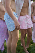 Printed swim shorts in light blue and pink, with drawstring waist ties