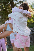 Pink printed swim shorts with drawstring waist and side tie detail