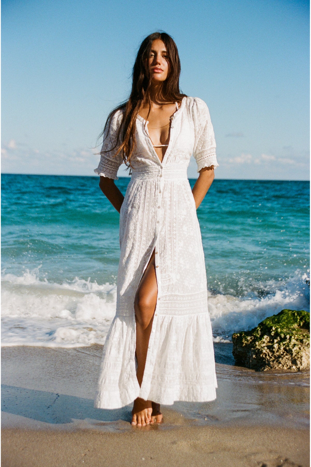 White maxi dress with V-neck button front and front slit, tiered skirt