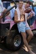Light blue printed swim shorts with drawstring waist tie and relaxed fit