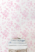 Pink floral rosette wallpaper pattern, light background with dense blossoms