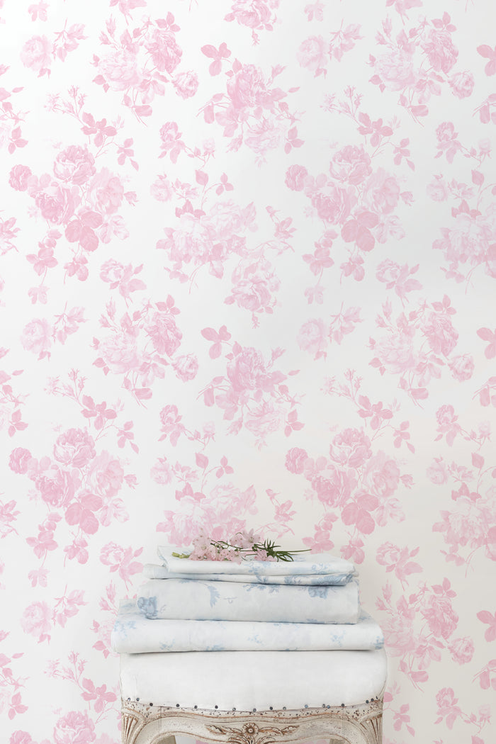 Pink floral rosette wallpaper pattern, light background with dense blossoms