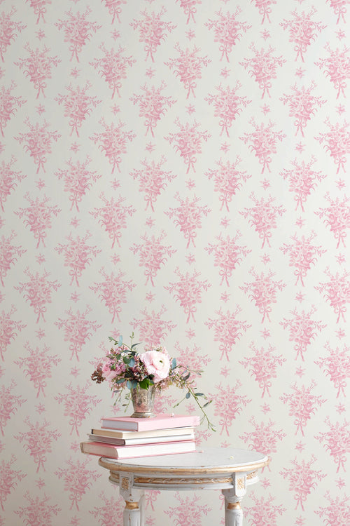 Light background wallpaper with repeating pink small floral bouquet silhouettes